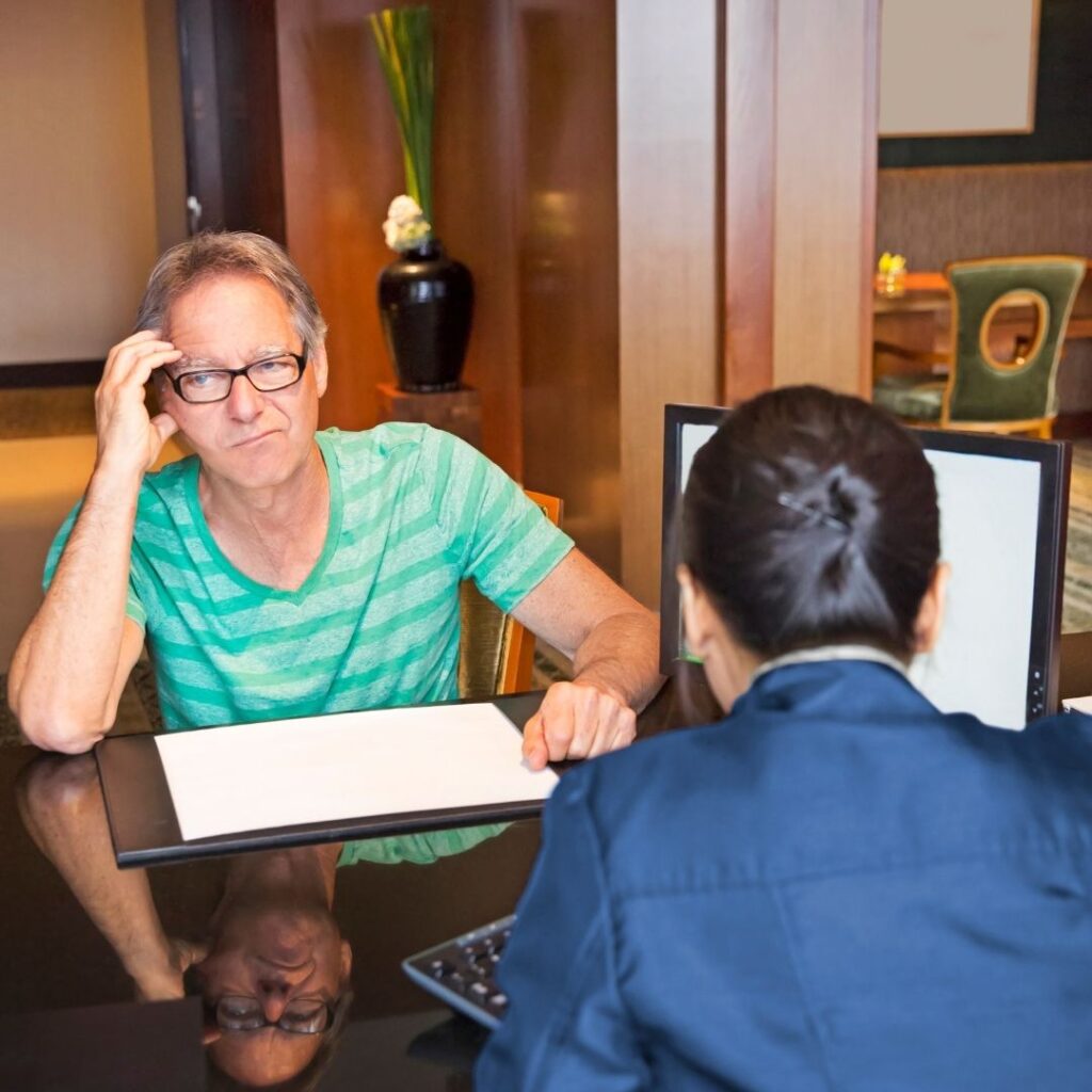 Man reviewing hotel bill