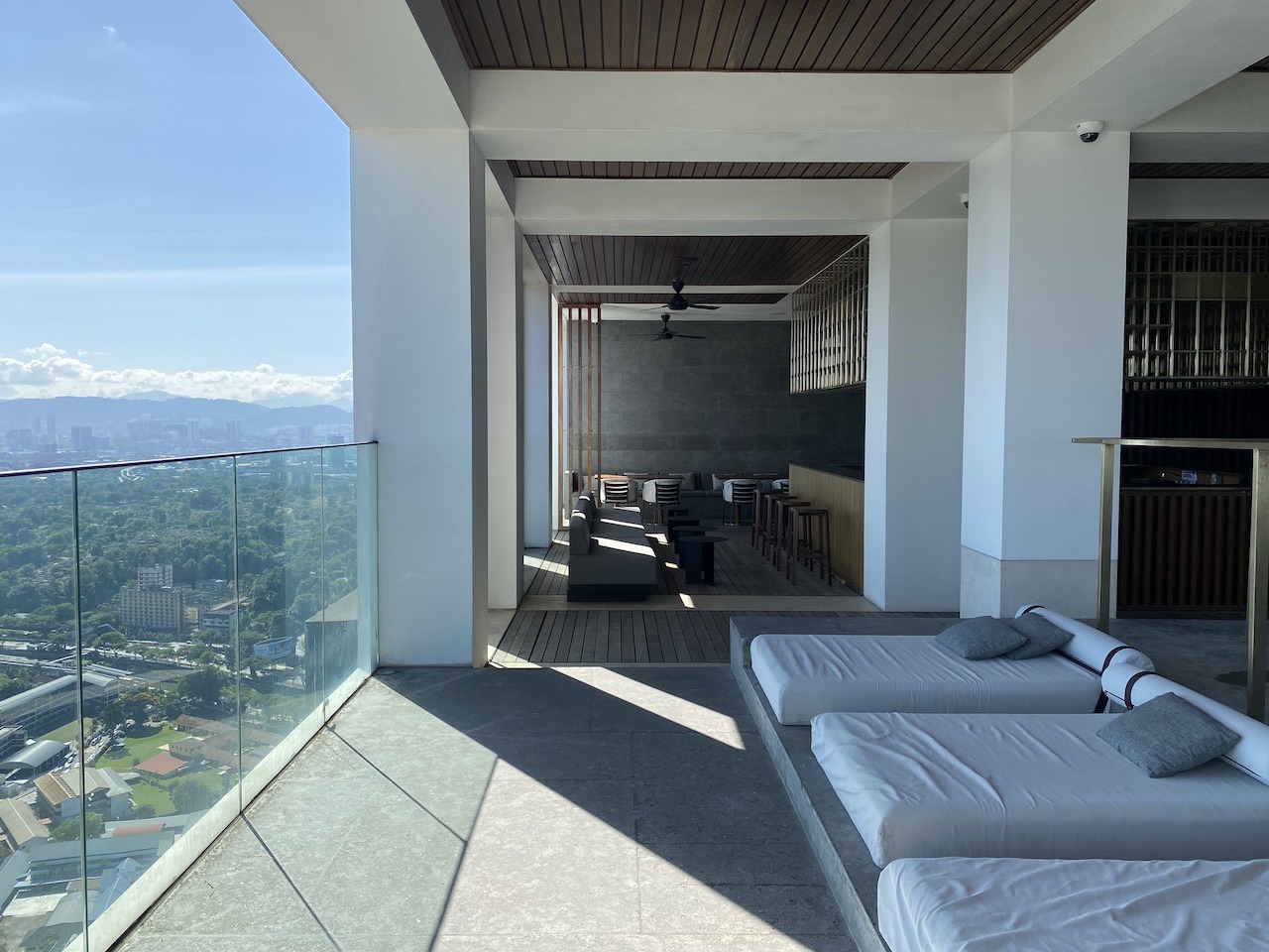 Hyatt Alila Bangasar pool loungers with city view