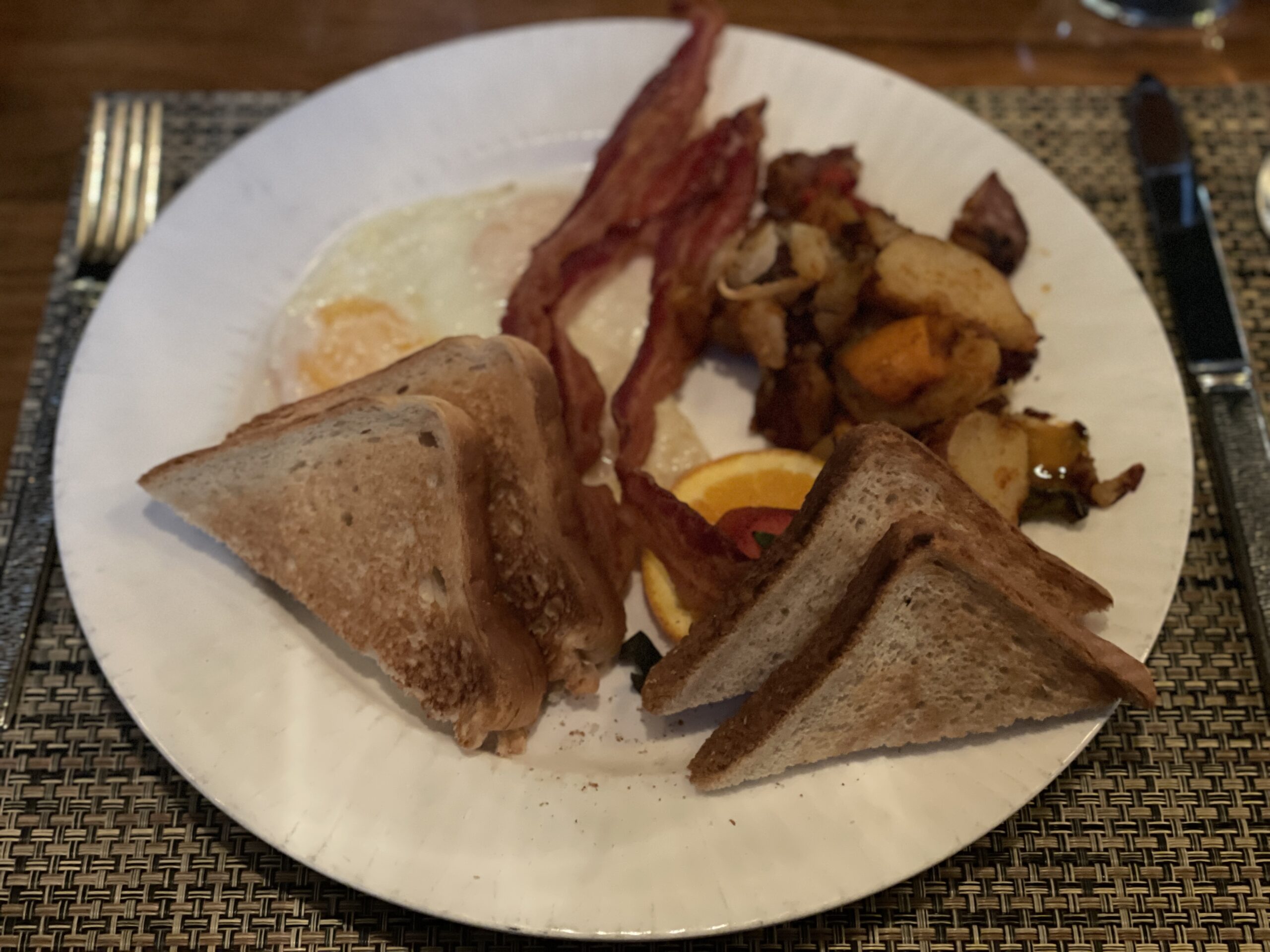 Breakfast of toast, fried eggs, bacon, and potatoes, Whitebark Restaurant Westin Monache 