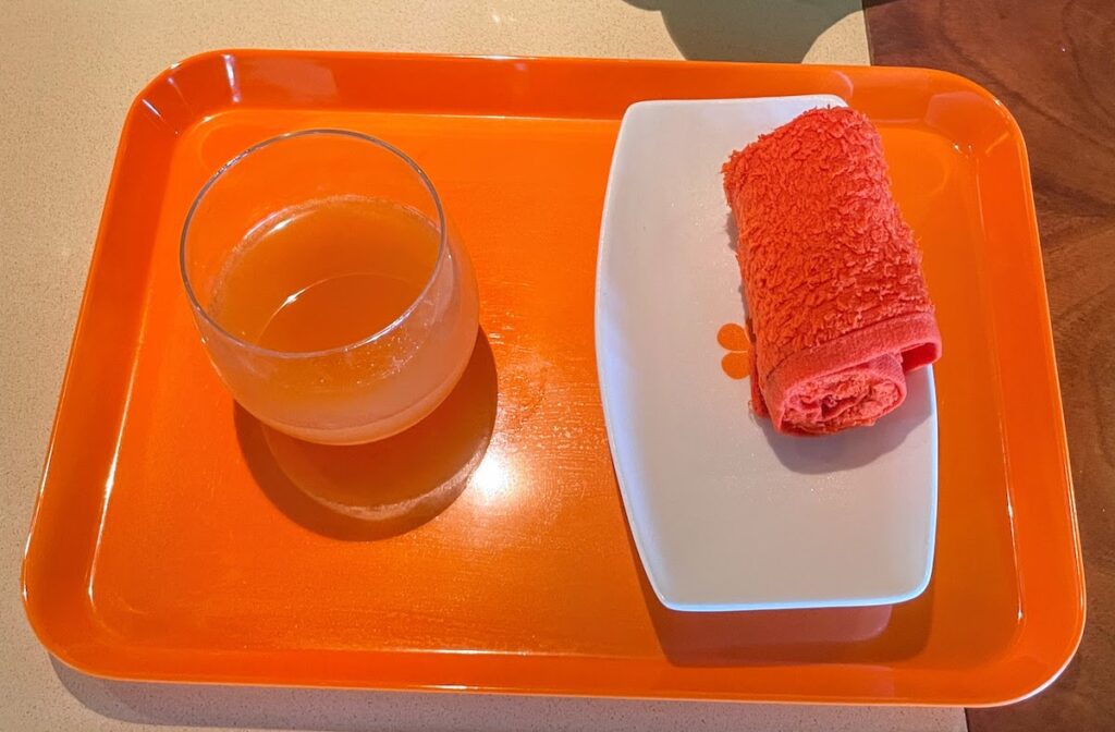 Checkin cold towel and passion orange juice at the Mauna Kea Beach Hotel
