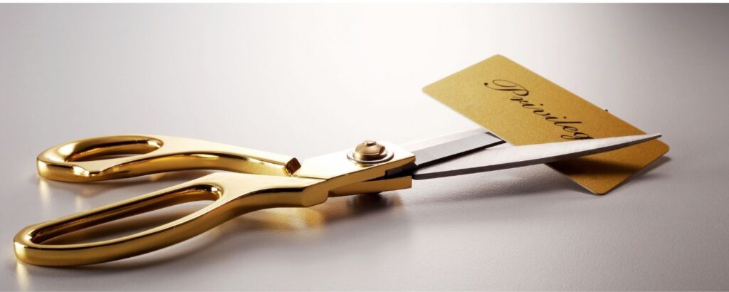 Golden Scissors Cutting Golden Credit Card