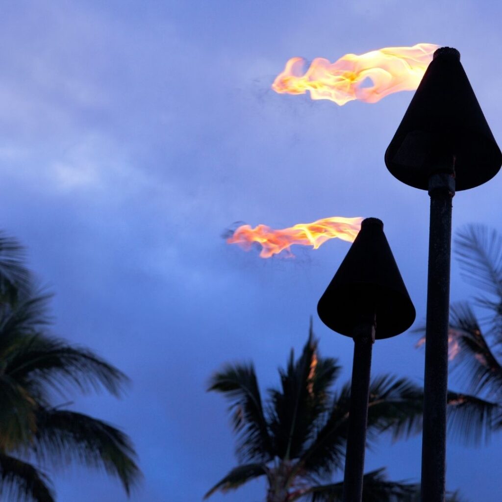 Tiki torches at Polynesian cultural center which runs the Alii luau, one of the best luaus in Hawaii