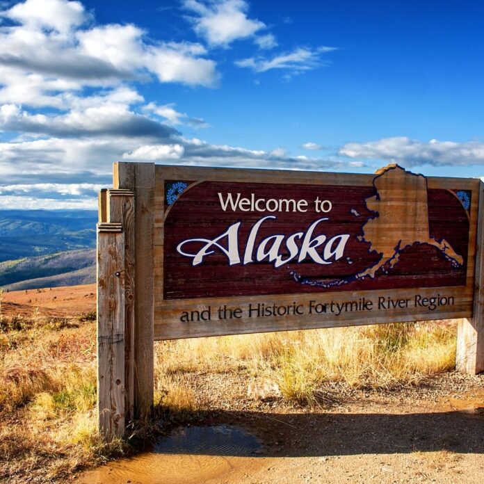 Welcome to Alaska sign for best budget hotels in alaska article