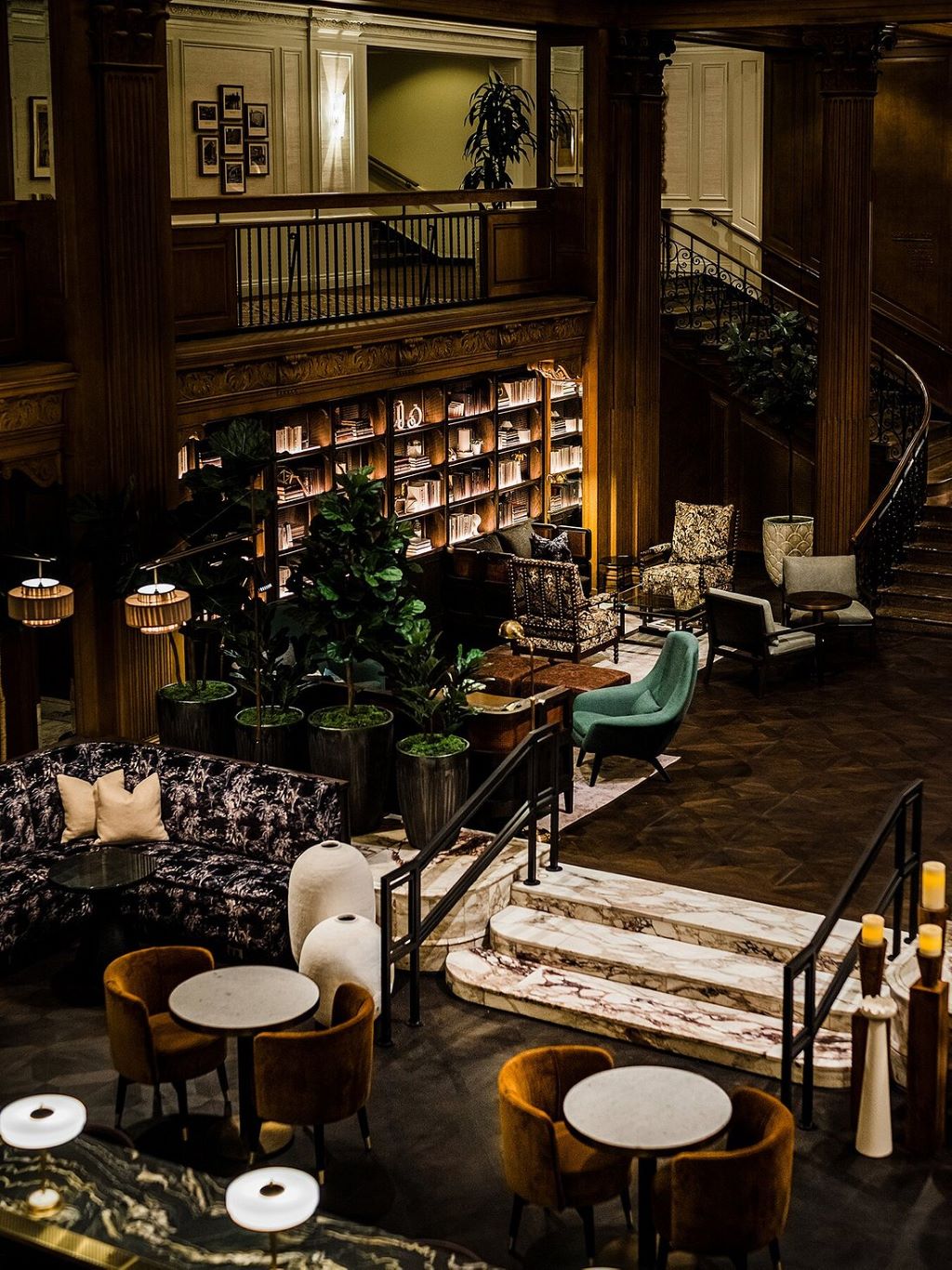 the hotel balcony view, where stairs are going down towards a beautiful sitting area