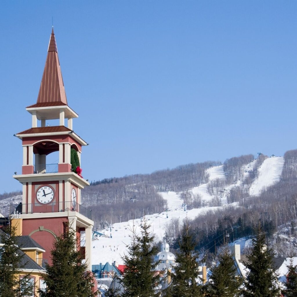View of the clock tower and ski runs at Mont-Tremblant