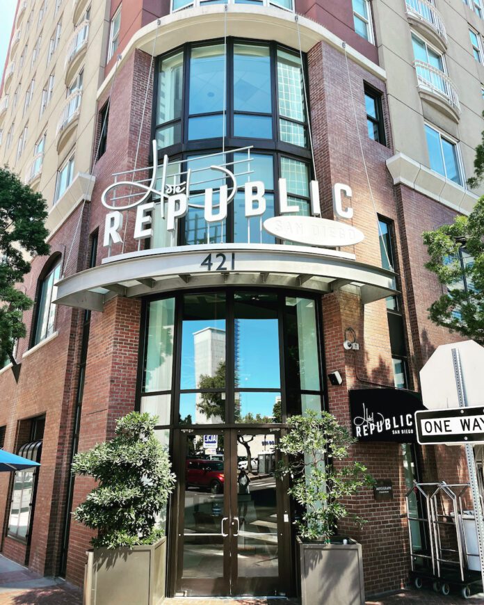 a building with glass doors and a sign