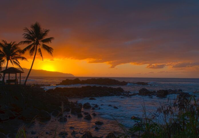 a sunset over a beach