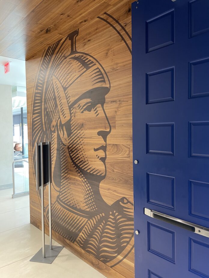 a blue door with a picture of a man on the wall