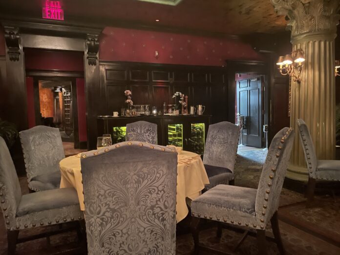 a room with a table and chairs