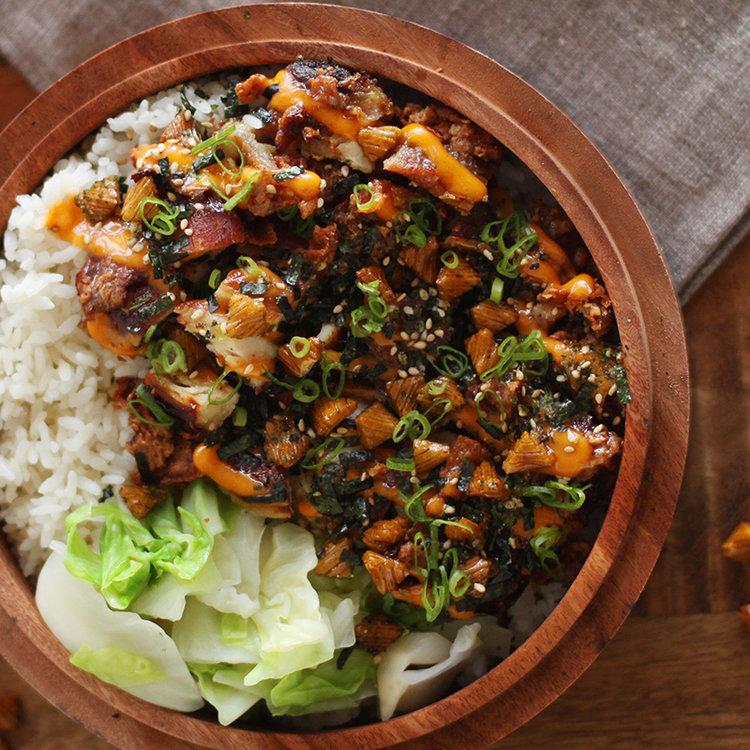 a bowl of food with rice and vegetables