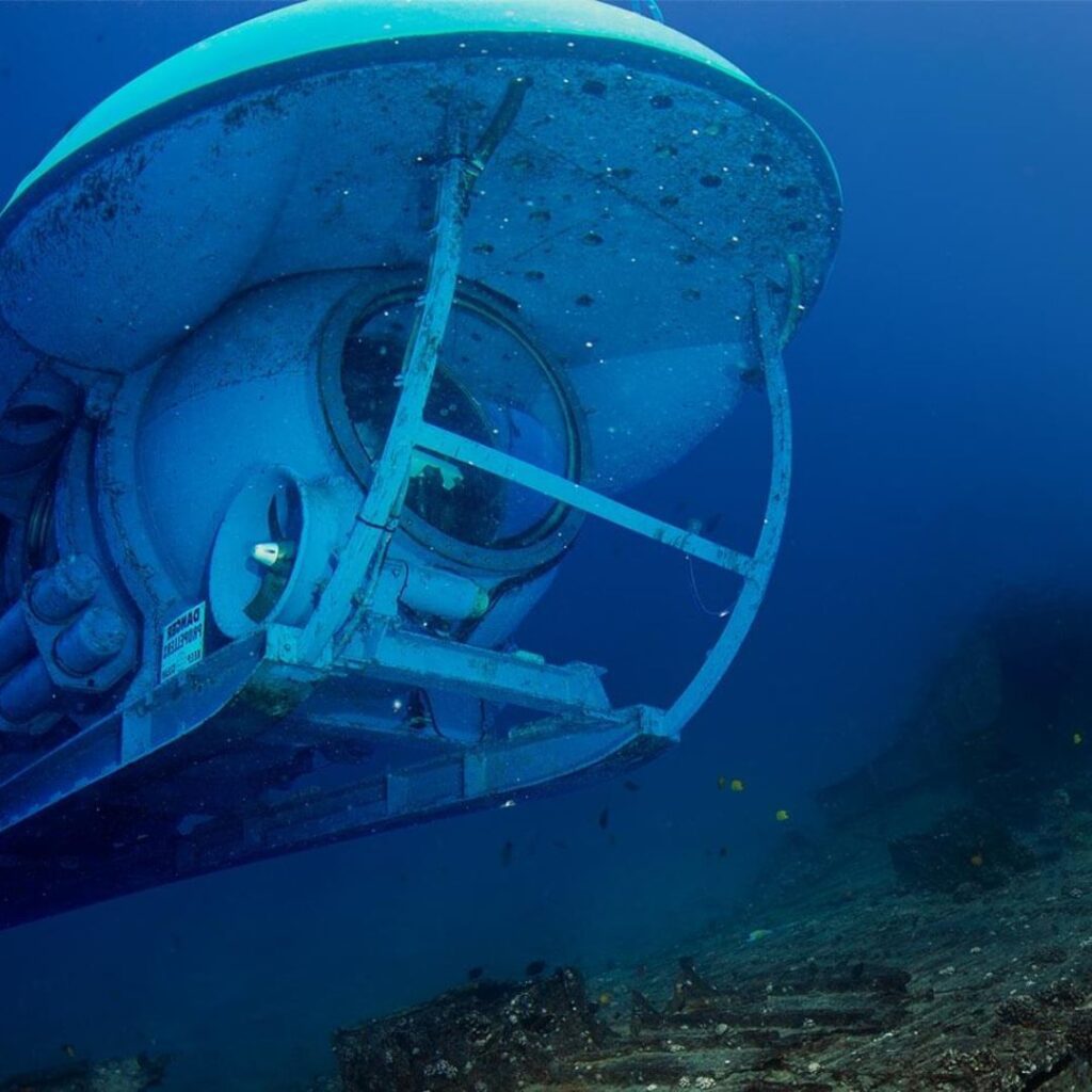 a submarine under water with a boat