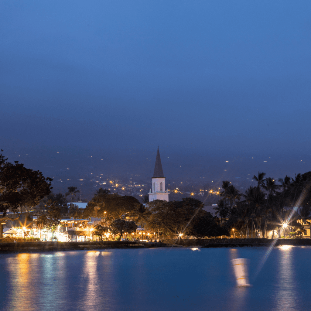 View of Kailua-Kona at night. This is the number one place to visit on my list of the 49 best things to do in Kona.