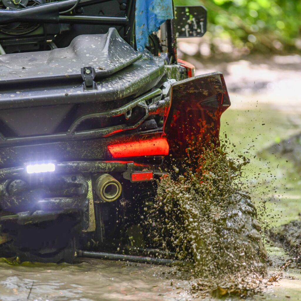 a close up of a vehicle splashing mud