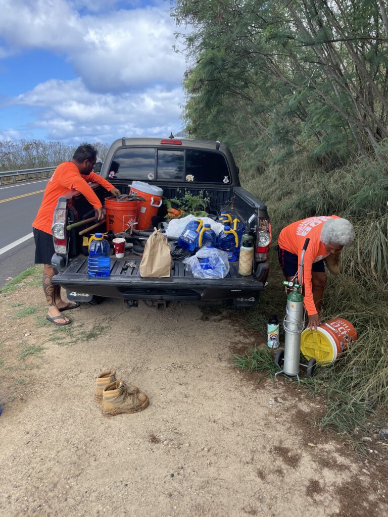 Main meeting area and pickup truck with tools for the Kaupo Hillside Restoration event.