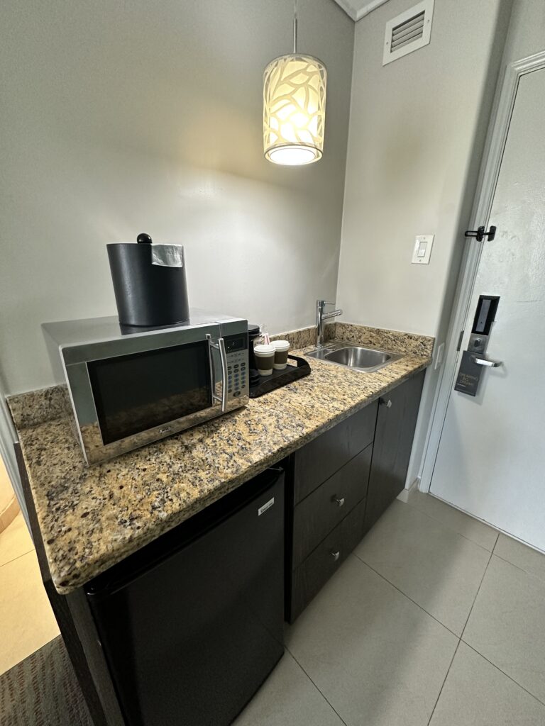 a kitchen with a sink and microwave