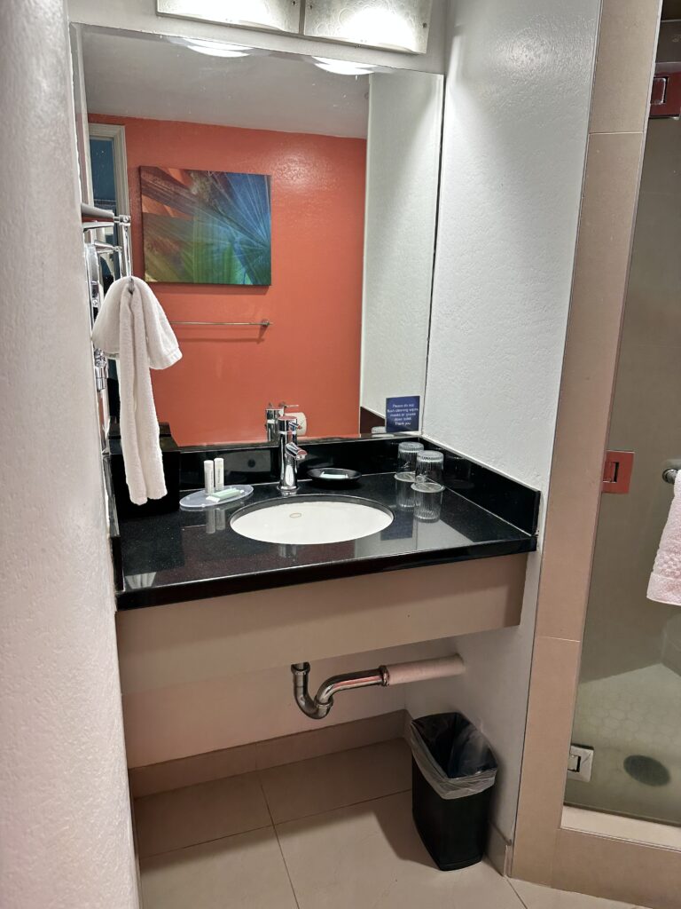 a bathroom with a mirror and sink