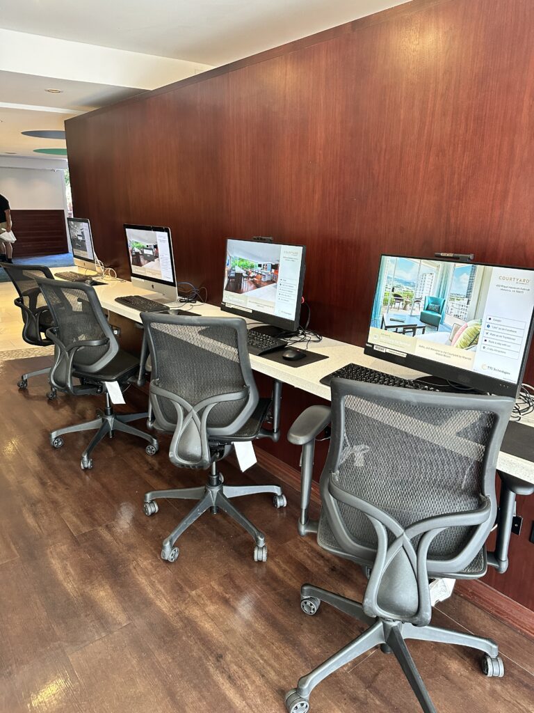 a row of computers in a room