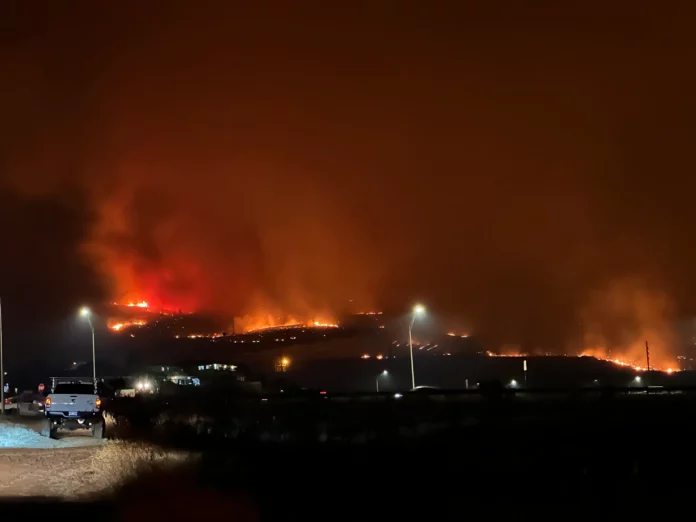 a fire in the mountains at night