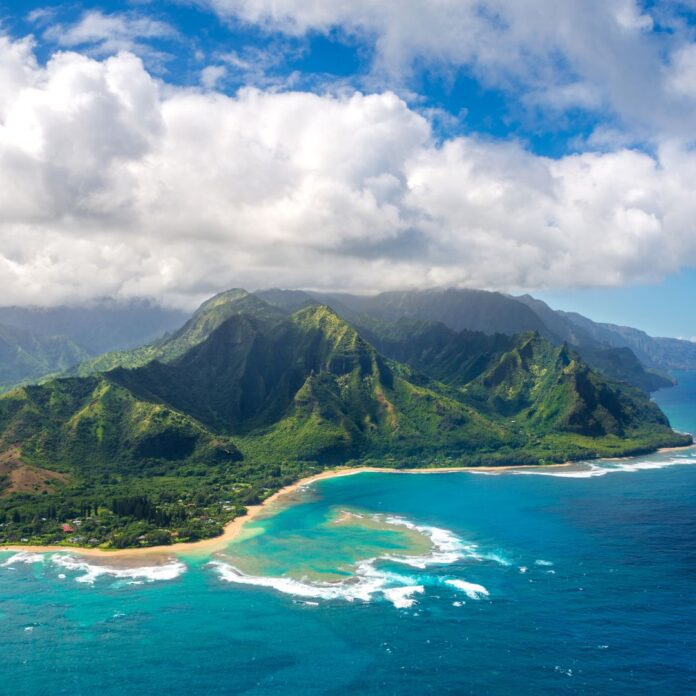 a aerial view of a beach and mountains