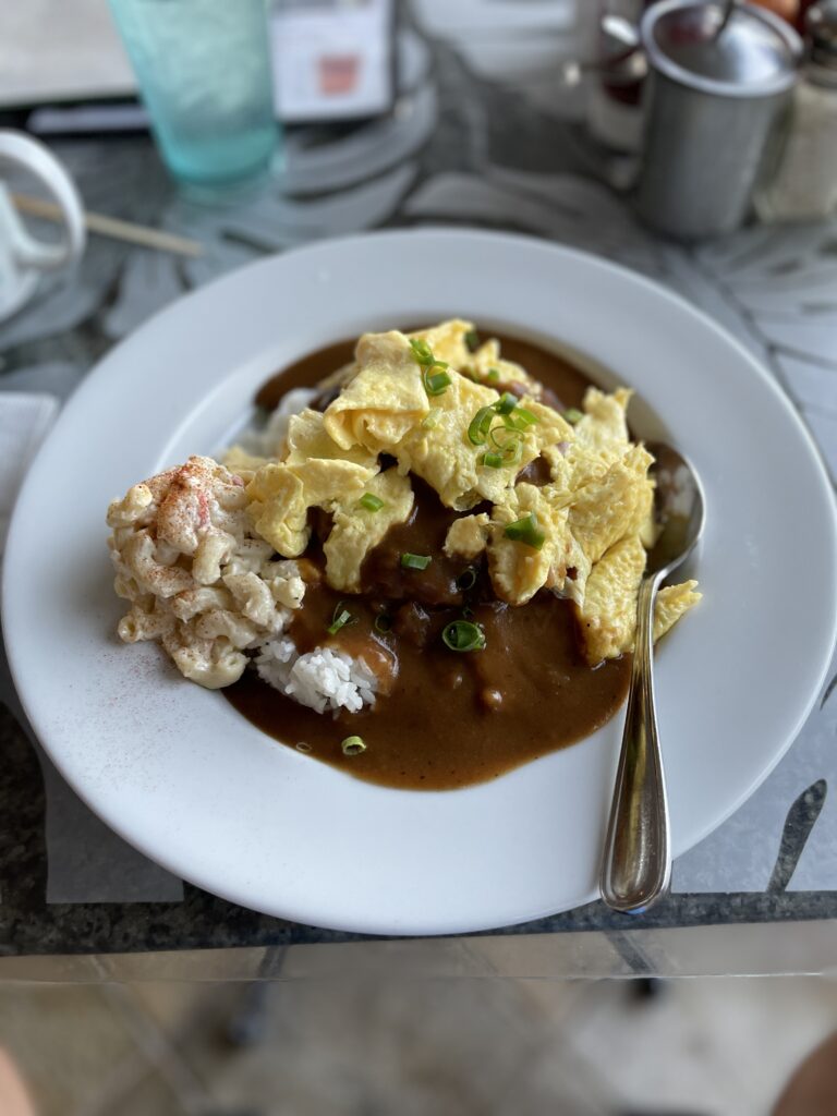 a plate of food with a spoon