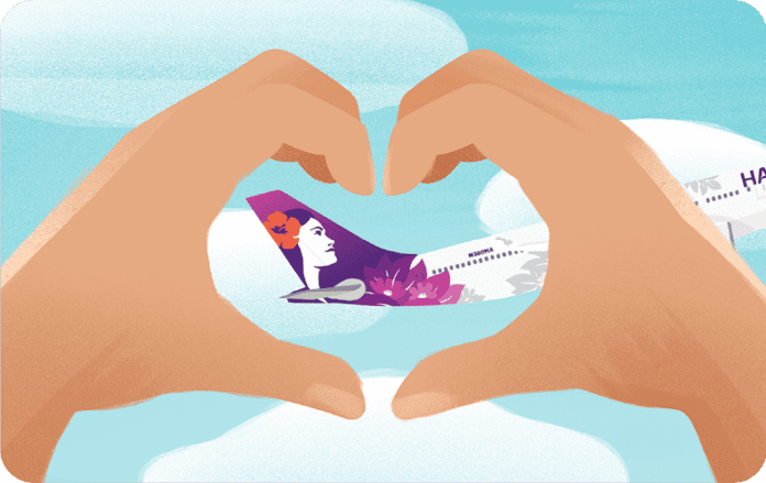 a hand making a heart with a plane
