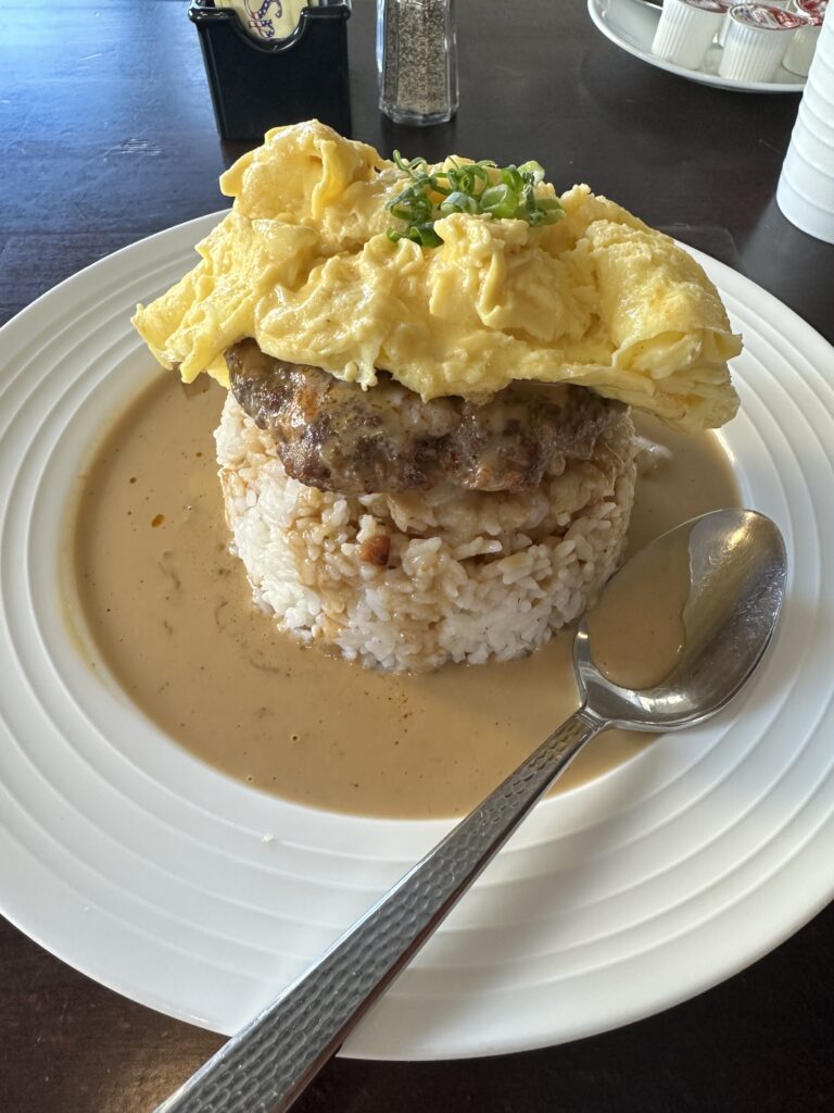 a plate of food with a spoon