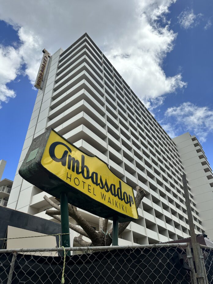 a large hotel building with a sign