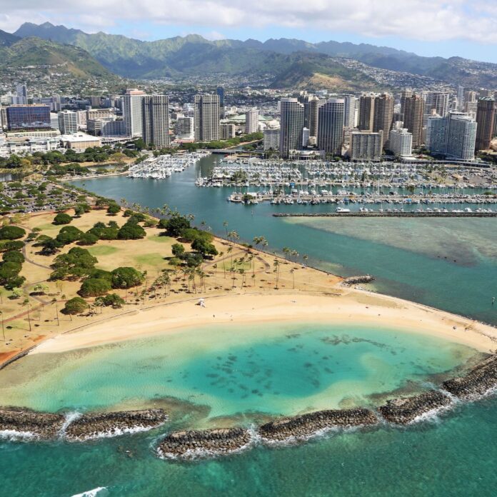 a aerial view of a city and a beach