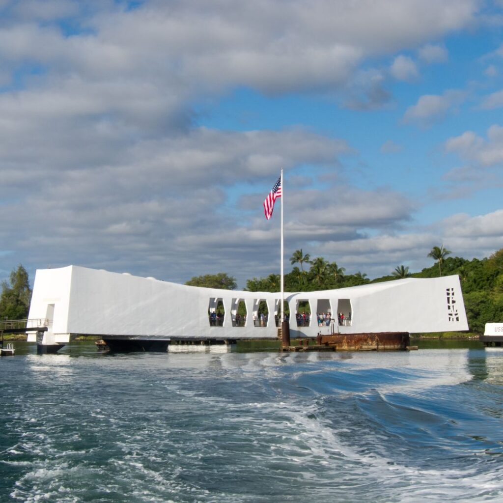 a white building with a flag on the side of it