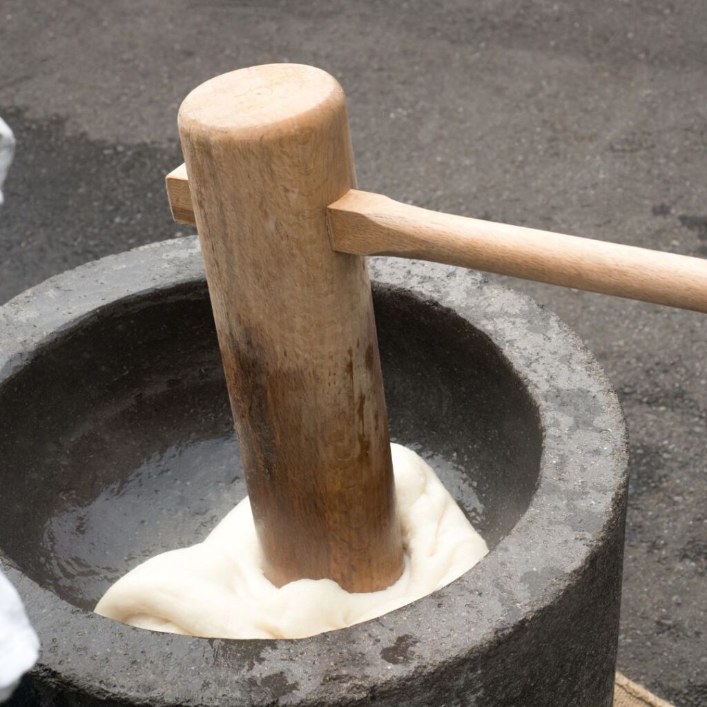 a wooden stick in a mortar