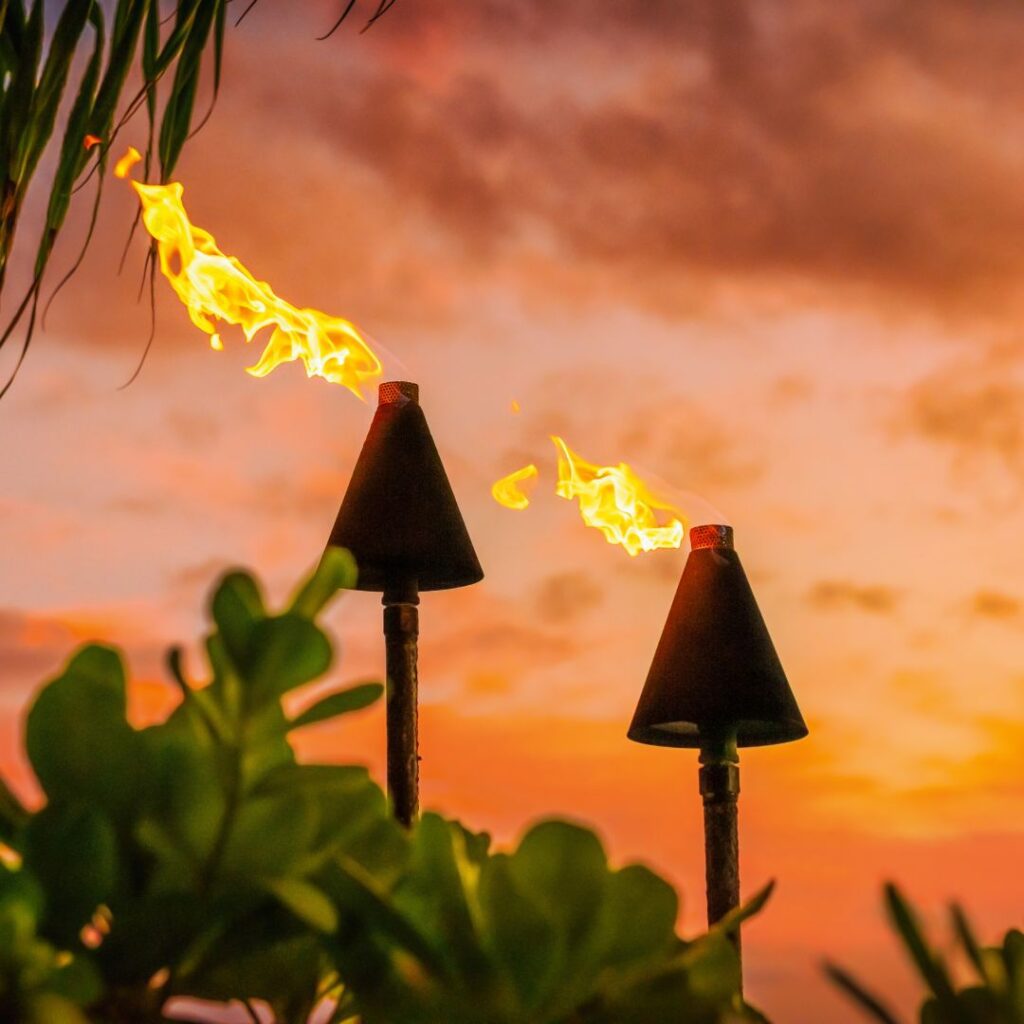 a tiki torches with fire coming out of them