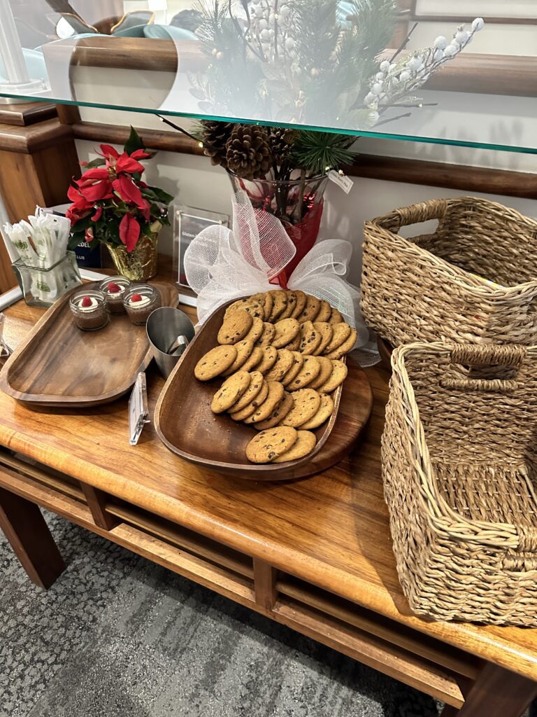 a table with a tray of cookies and baskets
