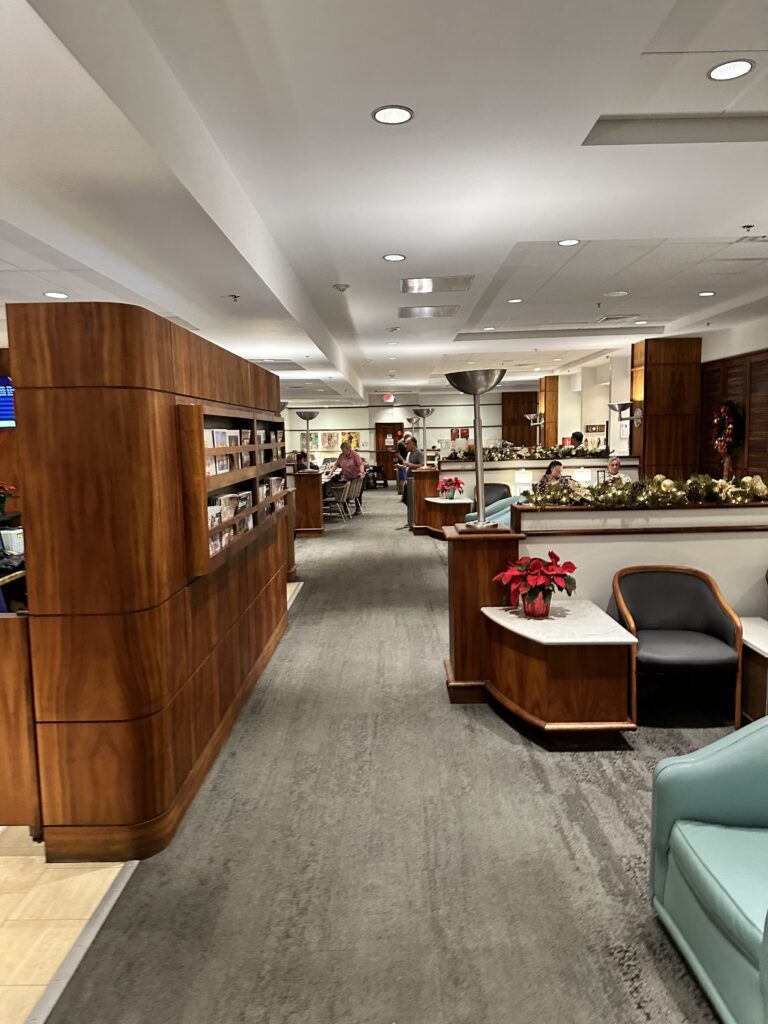 a lobby with a desk and chairs