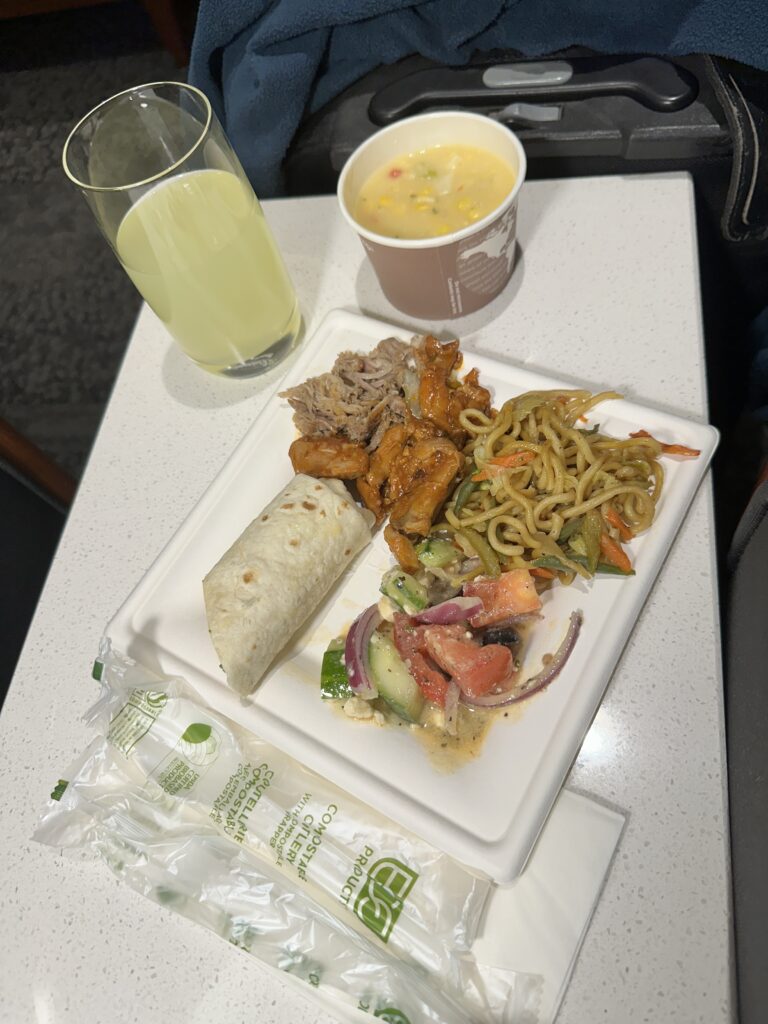 a plate of food and a drink on a table