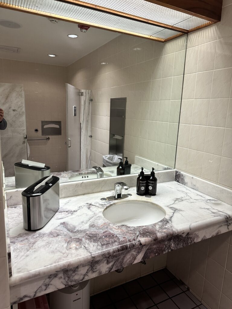 a bathroom with a marble countertop