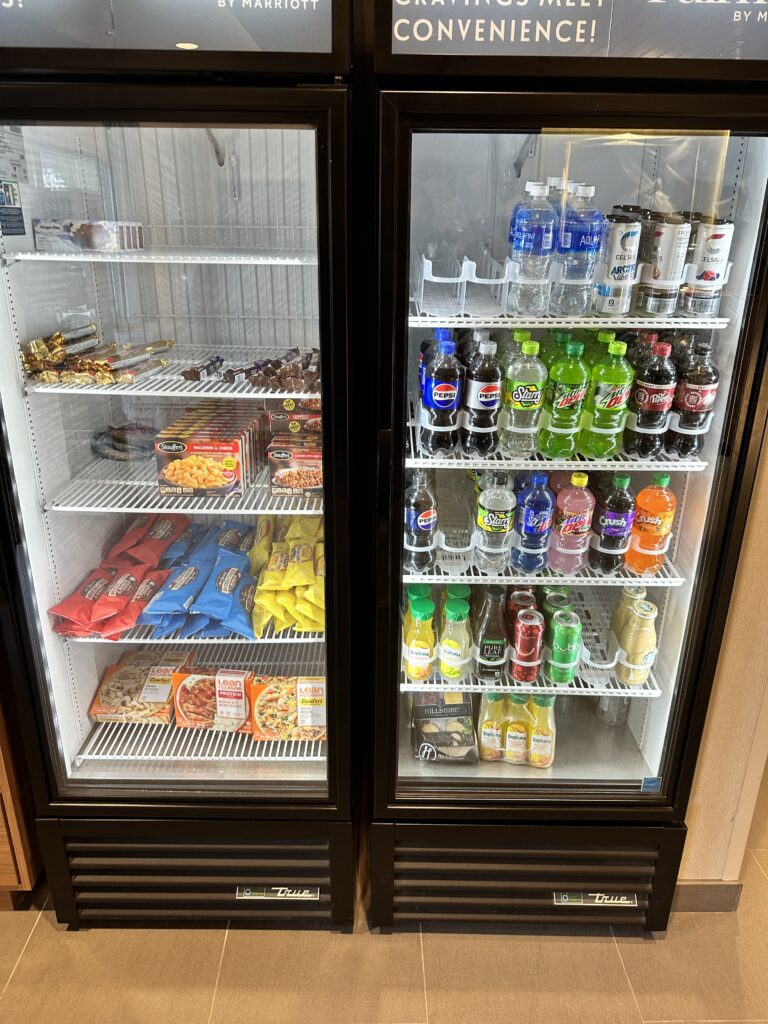 a refrigerator with drinks and snacks