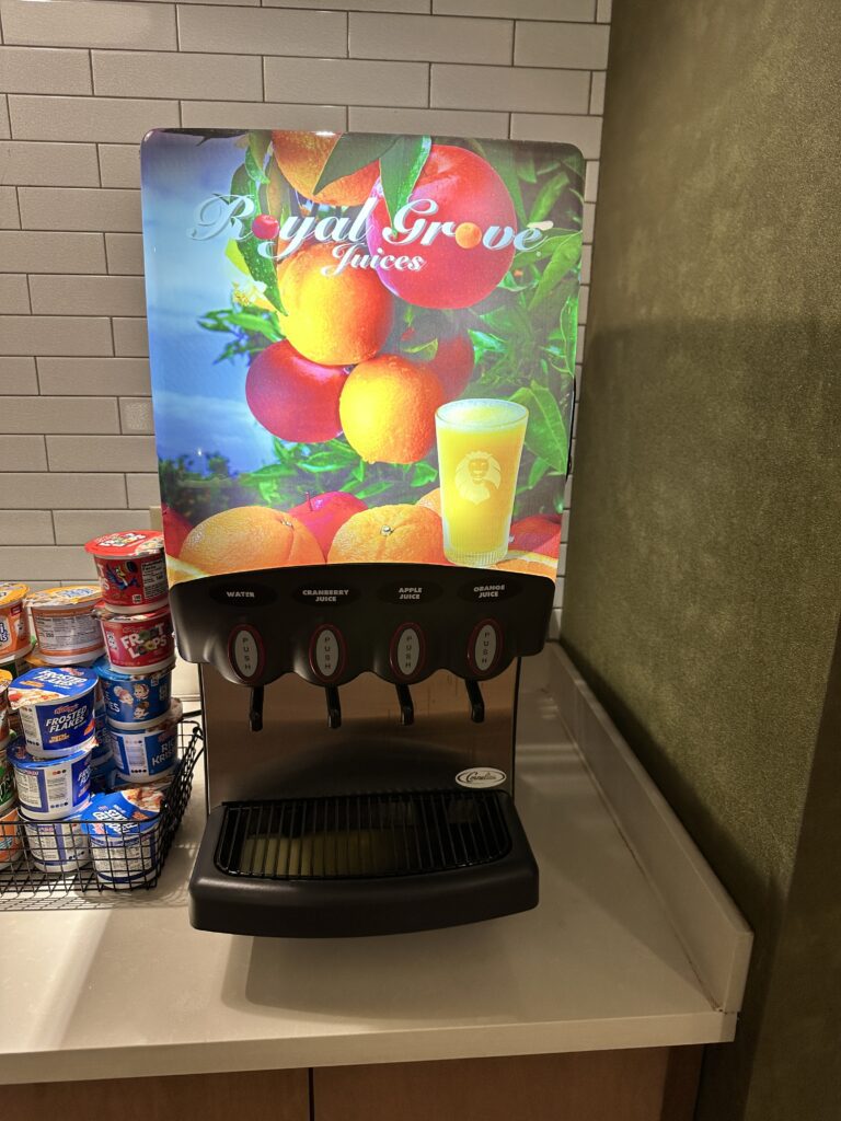 a beverage dispenser with a poster on it