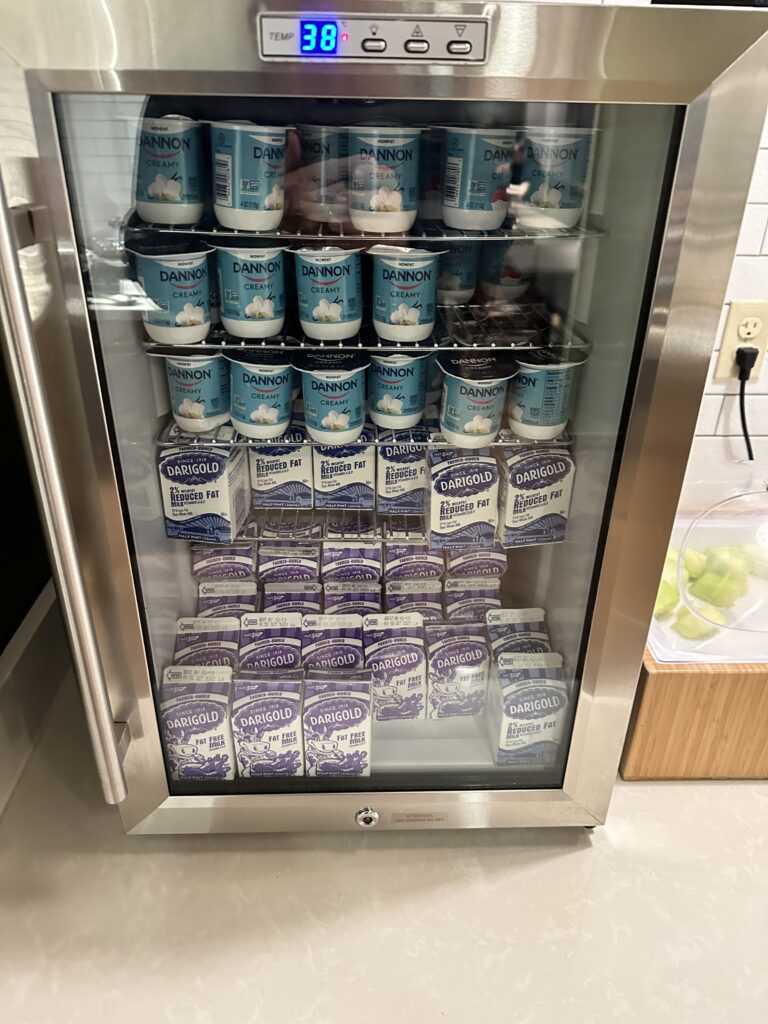 a refrigerator with yogurt and other dairy products