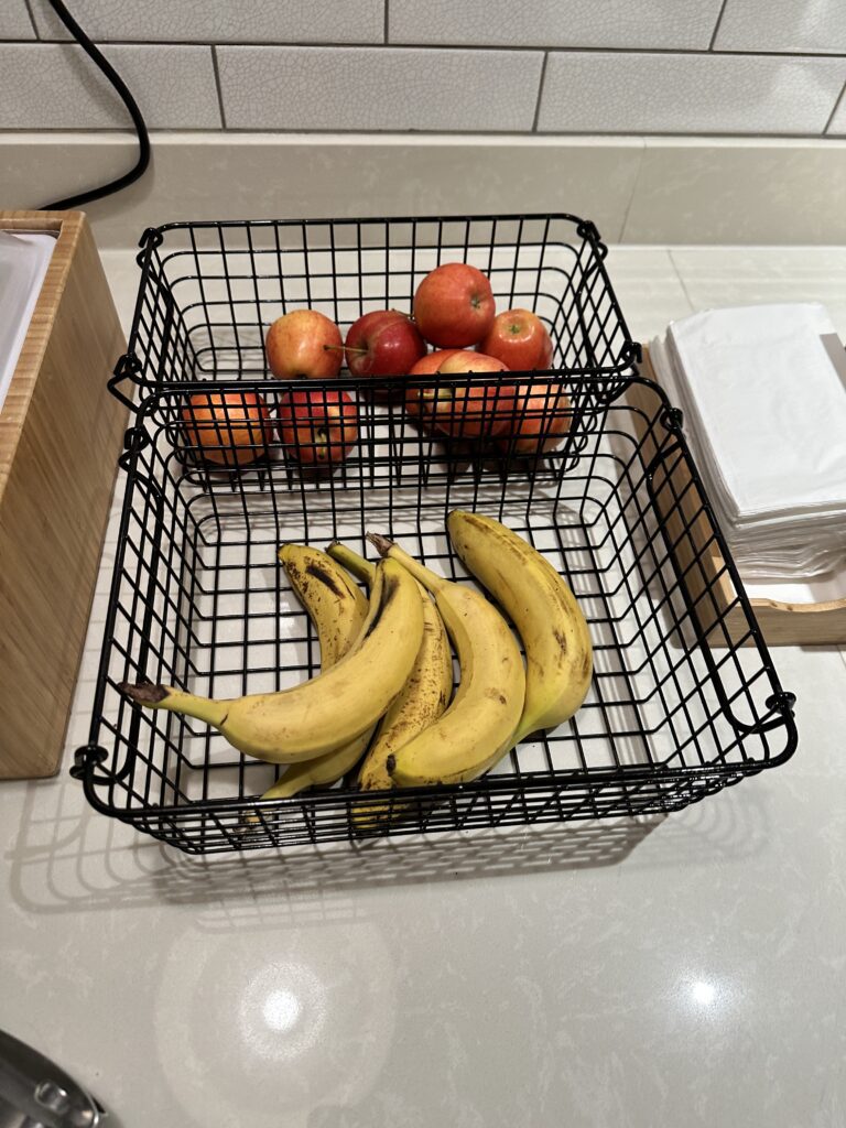 a basket of fruit and a bunch of bananas
