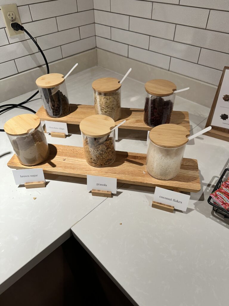 a group of jars of food on a wooden board