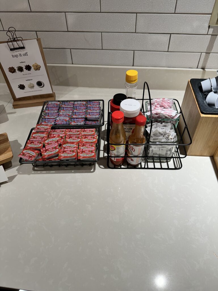 a group of condiments in a wire rack