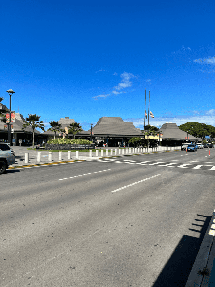 a road with cars and buildings