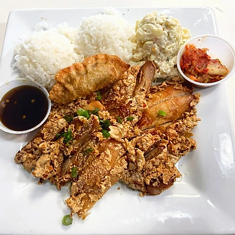 a plate of food with sauces and rice