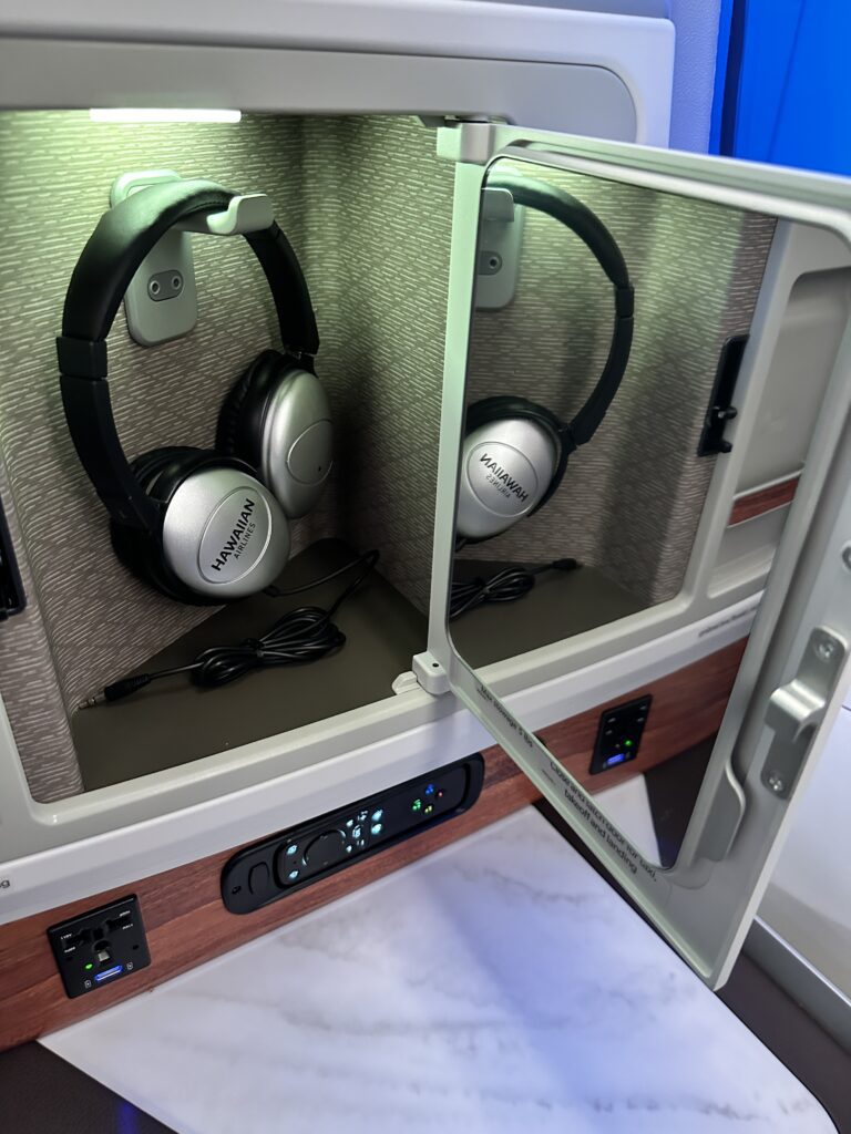 a pair of headphones in a small cabinet