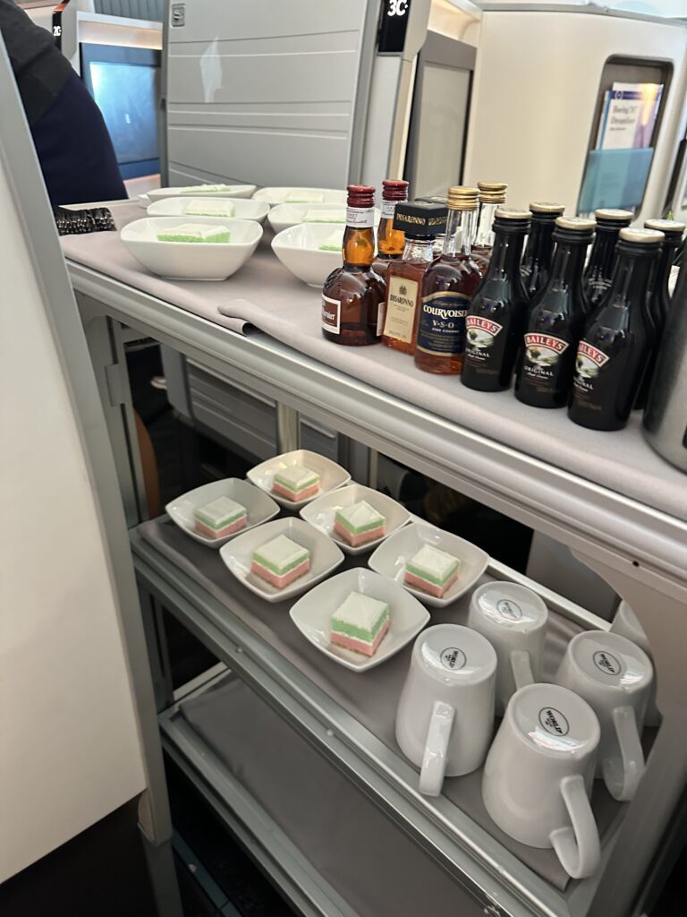 a shelf with food and drinks on it